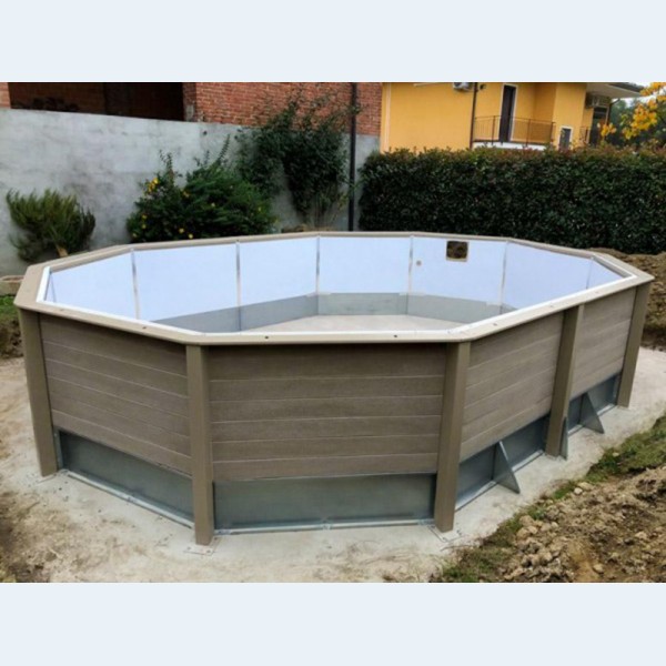 Installazione Piscina Seminterrata effetto legno in pietra ricostruita decagonale allungata NATURALIS 7,75 x 4,72